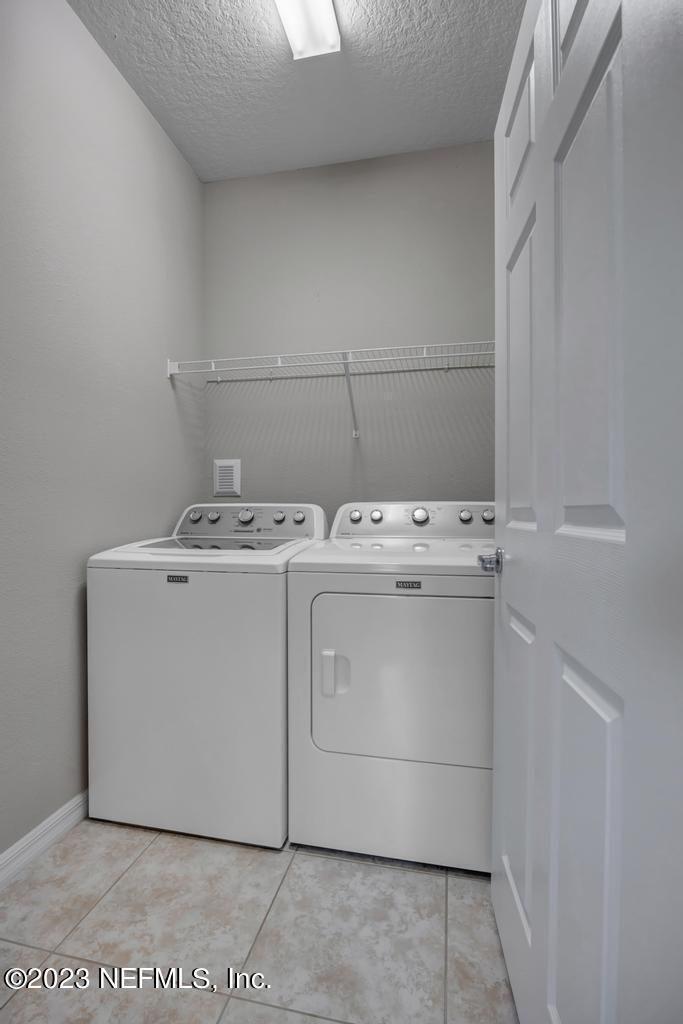 265 Caspia Lane Ponte Vedra, FL 32081 - Photo 29 of 86 a utility room with dryer and washer