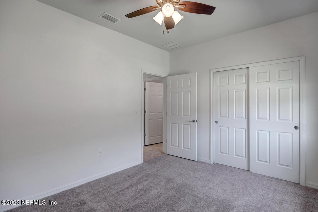 265 Caspia Lane Ponte Vedra, FL 32081 - Photo 33 of 86 an empty room with a chandelier fan