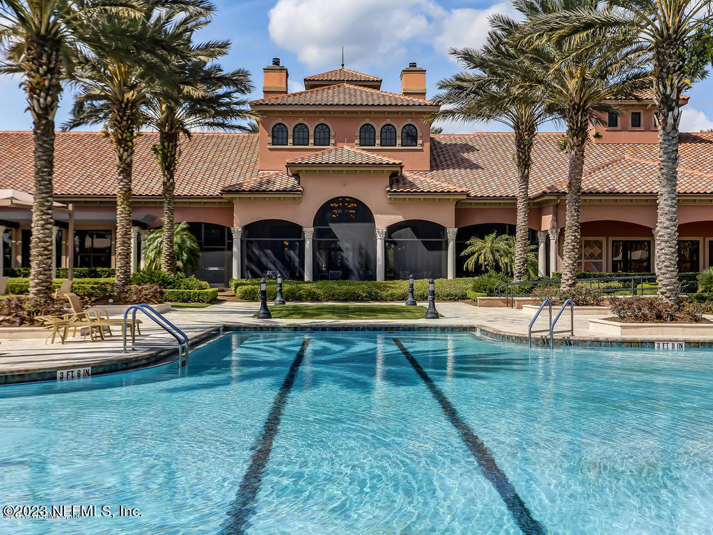 265 Caspia Lane Ponte Vedra, FL 32081 - Photo 57 of 86 a view of a house with swimming pool and a yard