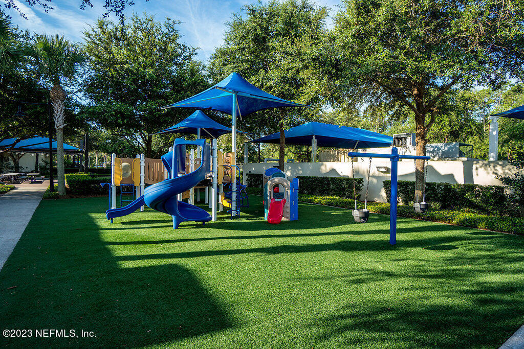 265 Caspia Lane Ponte Vedra, FL 32081 - Photo 61 of 86 a view of a park with swings and a table