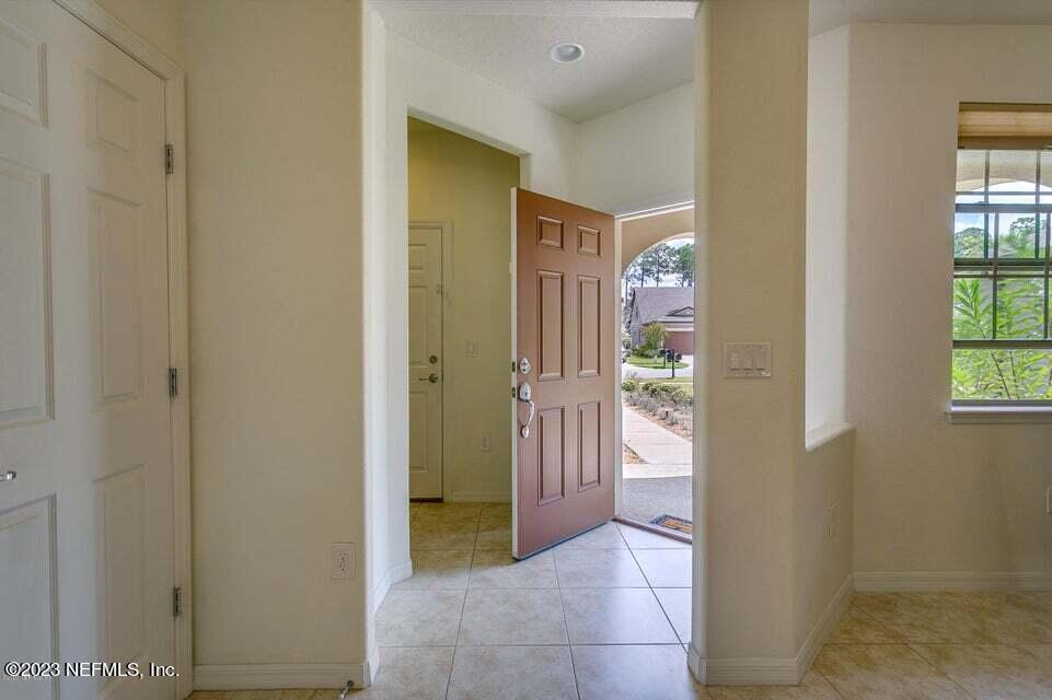 265 Caspia Lane Ponte Vedra, FL 32081 - Photo 7 of 86 a view of a hallway with bathroom and front door