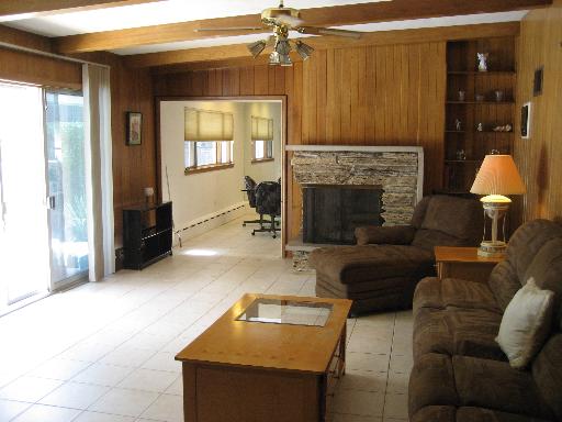 309 Uvedale Road Riverside, IL 60546 - Photo 3 of 15 a living room with furniture and a fireplace