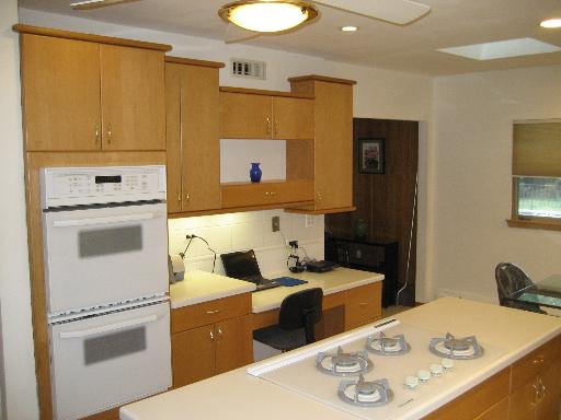 309 Uvedale Road Riverside, IL 60546 - Photo 4 of 15 a kitchen with a sink appliances and cabinets