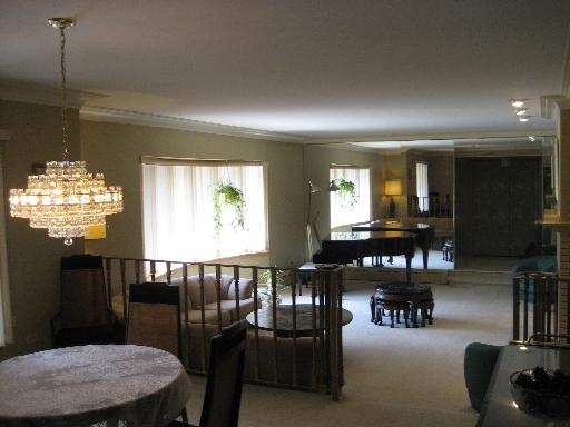 309 Uvedale Road Riverside, IL 60546 - Photo 6 of 15 a dining room with furniture a chandelier and window