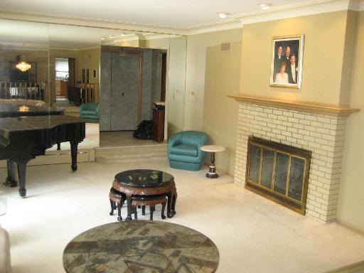 309 Uvedale Road Riverside, IL 60546 - Photo 7 of 15 a living room with furniture and a fireplace