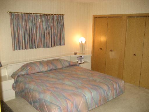 309 Uvedale Road Riverside, IL 60546 - Photo 9 of 15 a bedroom with a bed and a window