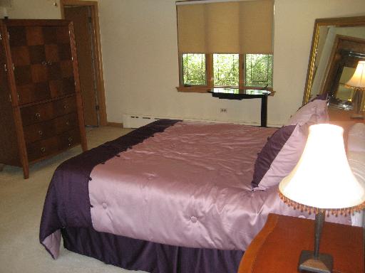309 Uvedale Road Riverside, IL 60546 - Photo 10 of 15 a bedroom with a bed and a window