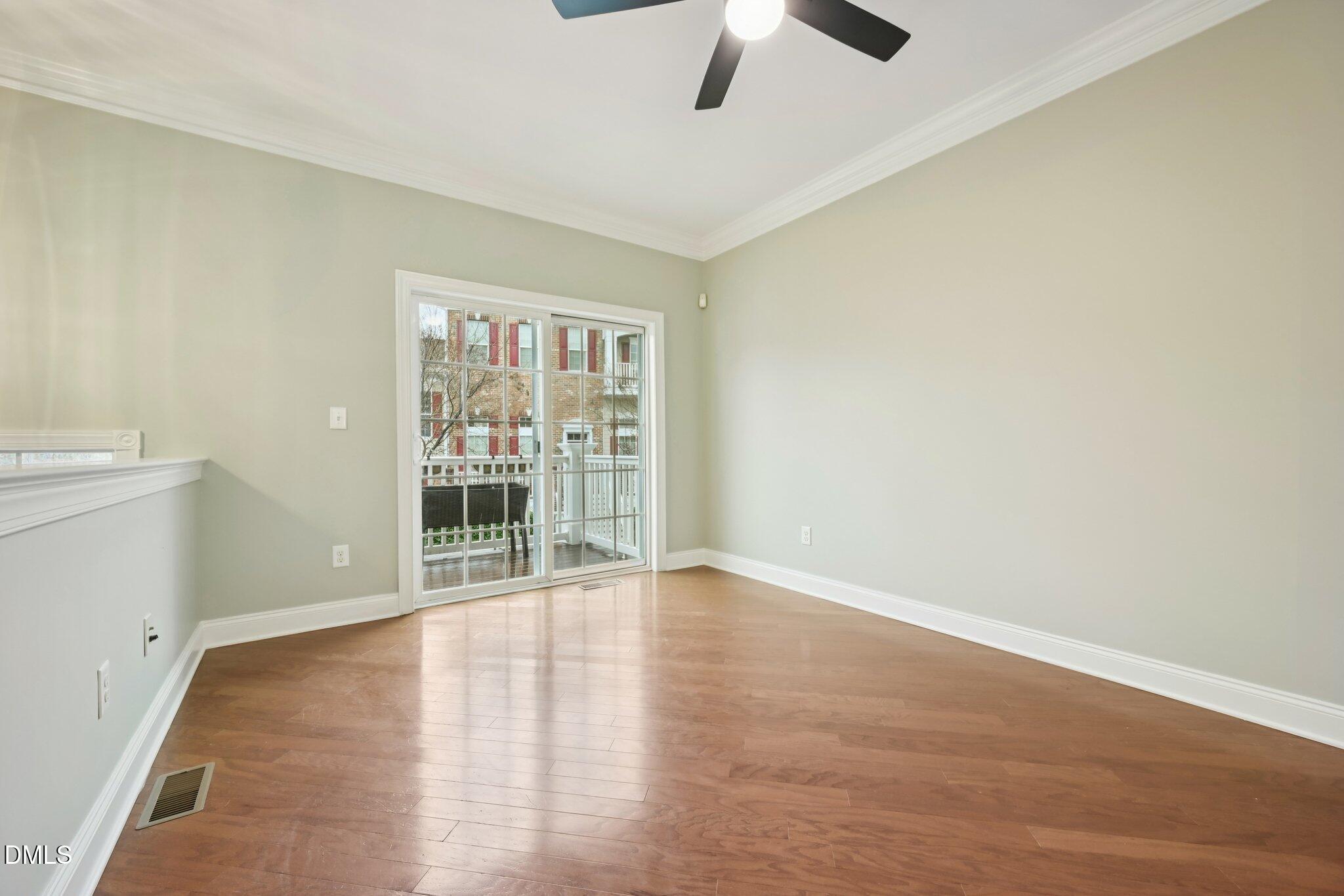 10510 Sablewood Drive, Unit 113 Raleigh, NC 27617 - Photo 4 of 38 wooden floor in an empty room with a window