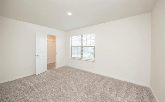 an empty room with closet area