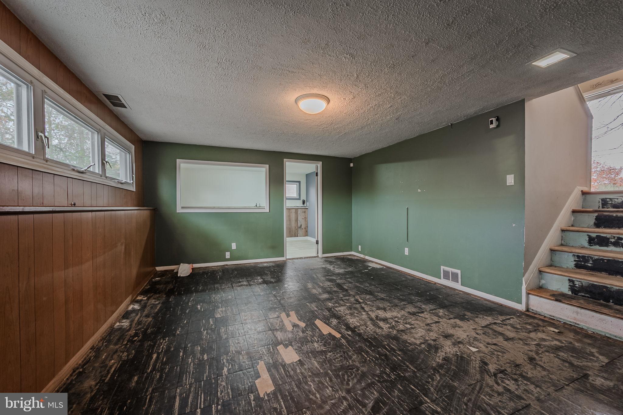 6 Merion Road Newark, DE 19713 - Photo 23 of 36 an empty room with wooden floor and windows