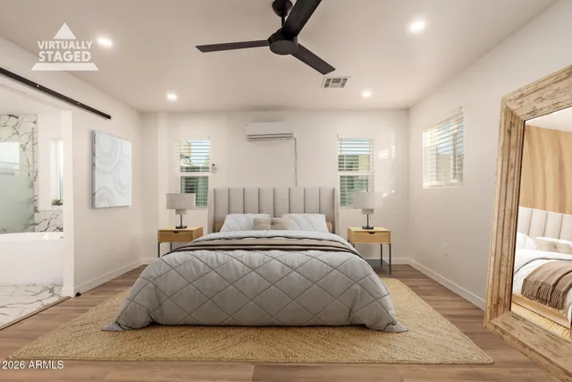 a bedroom with a bed and window