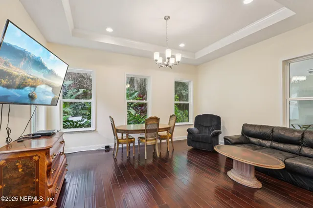 a kitchen with stainless steel appliances kitchen island granite countertop a stove a sink and a refrigerator