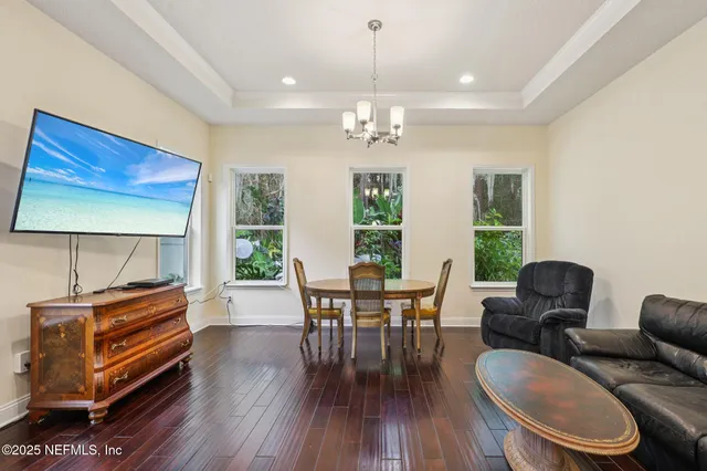 a view of a livingroom with furniture and staircase