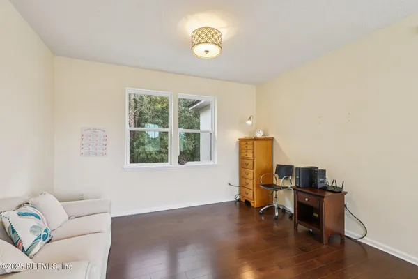 a view of a livingroom with furniture and staircase