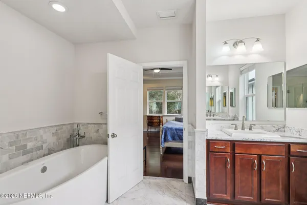 a bathroom with a bathtub and a shower