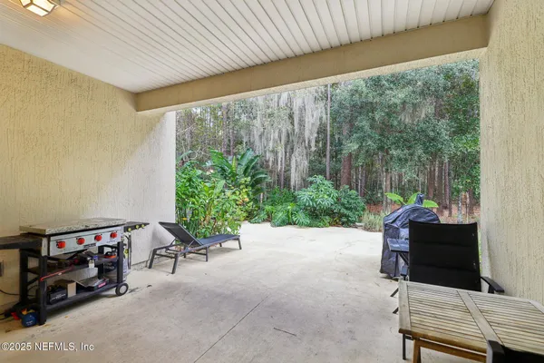 a view of a livingroom with workspace and a window