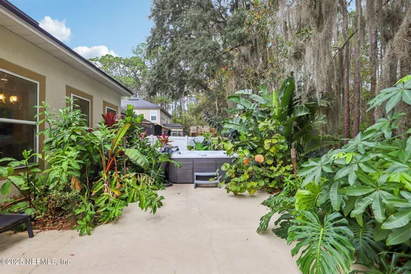 a view of a house with a garden and pathway