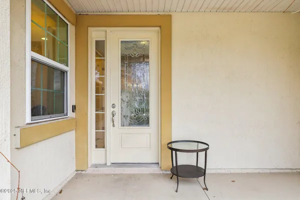 a view of a chair and a table in a room