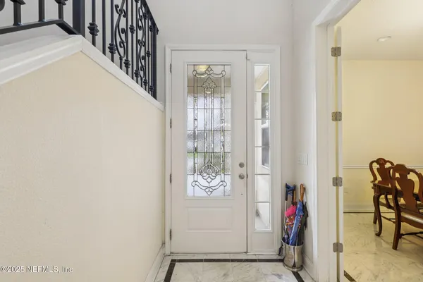 an entryway with a flower pot