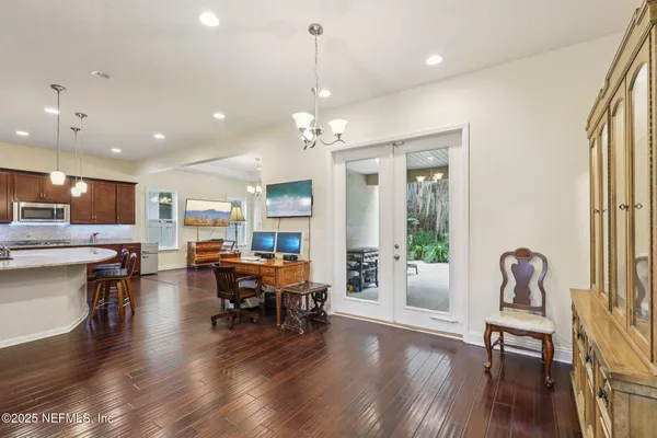 a view of a dining room with furniture window and wooden floor