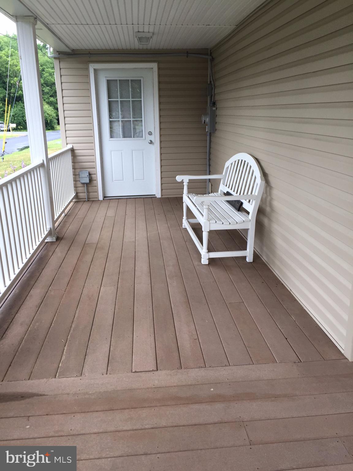 1401 Cox Neck Road Chester, MD 21619 - Photo 23 of 32 Wraparound porch Northern exposureDoor to Kitchen.