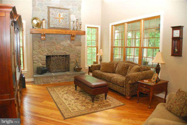 4444 Teen Barnes Road Jefferson, MD 21755 - Photo 11 of 30 a living room with furniture and a fireplace