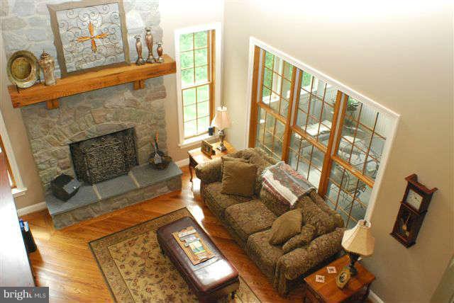 4444 Teen Barnes Road Jefferson, MD 21755 - Photo 12 of 30 a living room with furniture and a fireplace