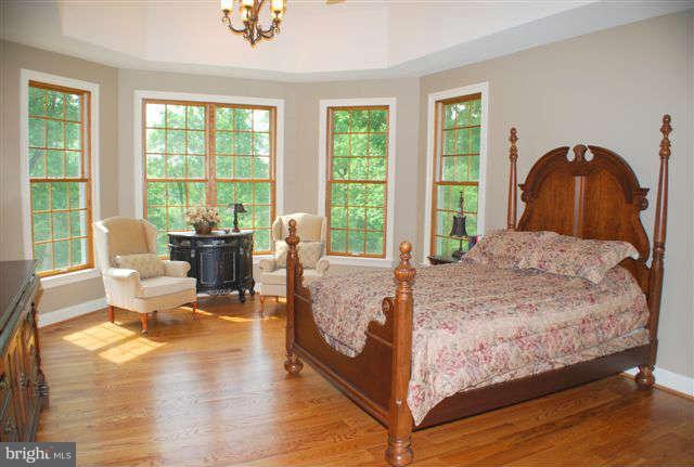 4444 Teen Barnes Road Jefferson, MD 21755 - Photo 14 of 30 a bedroom with a bed and large windows