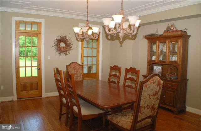 4444 Teen Barnes Road Jefferson, MD 21755 - Photo 6 of 30 a view of a dining room with furniture wooden floor and chandelier