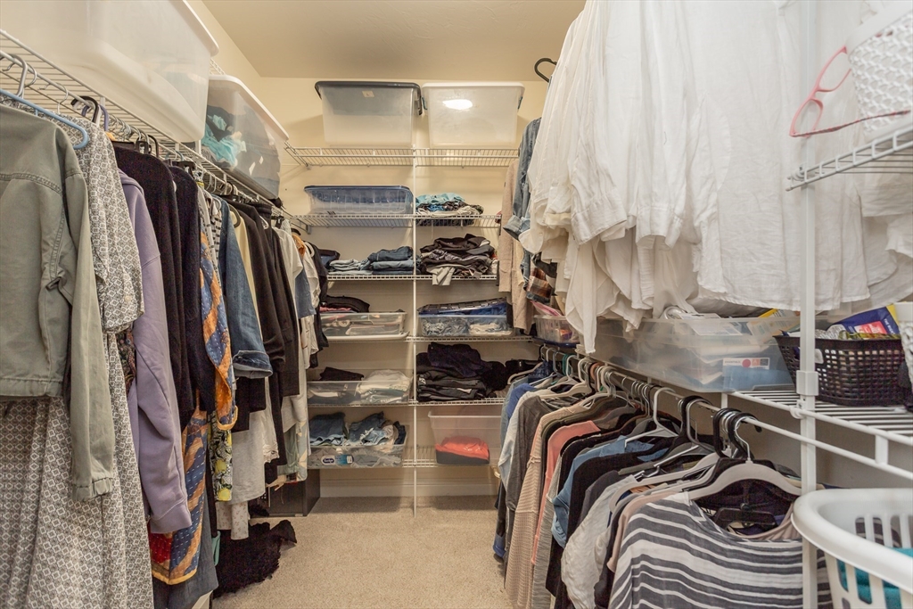 1481 Phillips Road, Unit 1305 New Bedford, MA 02745 - Photo 17 of 34 a view of walk in closet with clothes and shoes