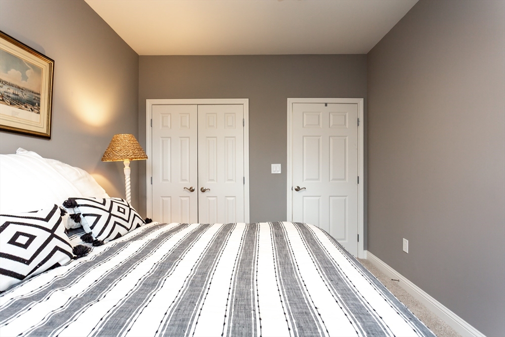 1481 Phillips Road, Unit 1305 New Bedford, MA 02745 - Photo 18 of 34 a bedroom with a bed and a window