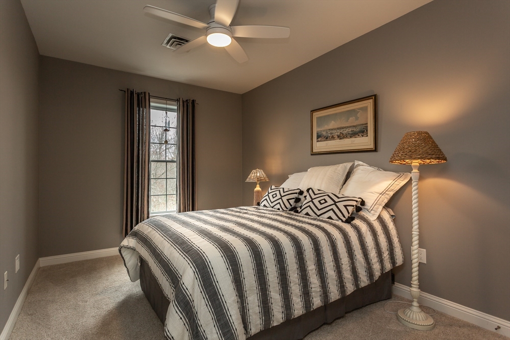 1481 Phillips Road, Unit 1305 New Bedford, MA 02745 - Photo 19 of 34 a bedroom with a bed and a window