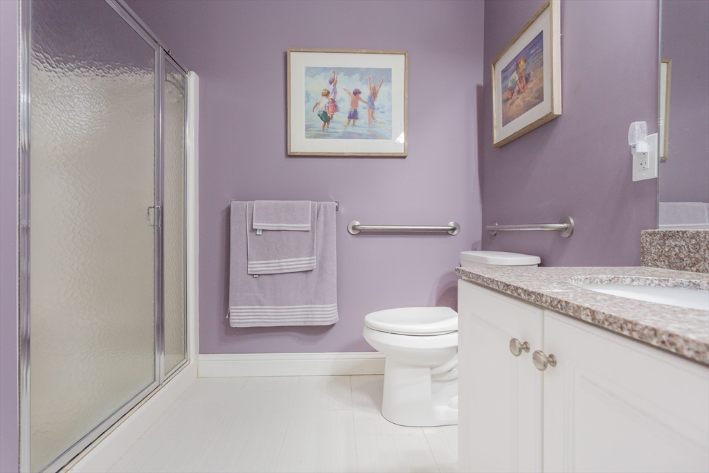 1481 Phillips Road, Unit 1305 New Bedford, MA 02745 - Photo 22 of 34 a bathroom with a granite countertop toilet and a sink