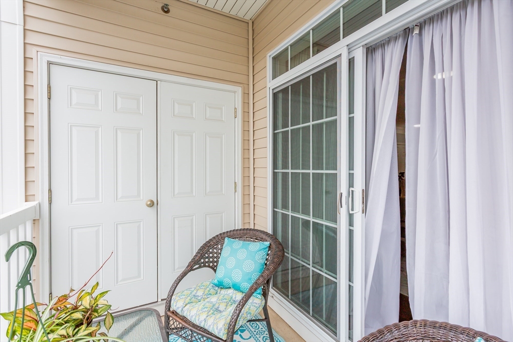 1481 Phillips Road, Unit 1305 New Bedford, MA 02745 - Photo 24 of 34 a view of a door and chair in the balcony