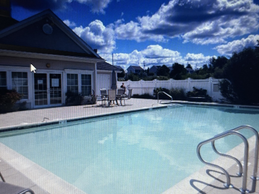 1481 Phillips Road, Unit 1305 New Bedford, MA 02745 - Photo 26 of 34 a view of a swimming pool with seating space