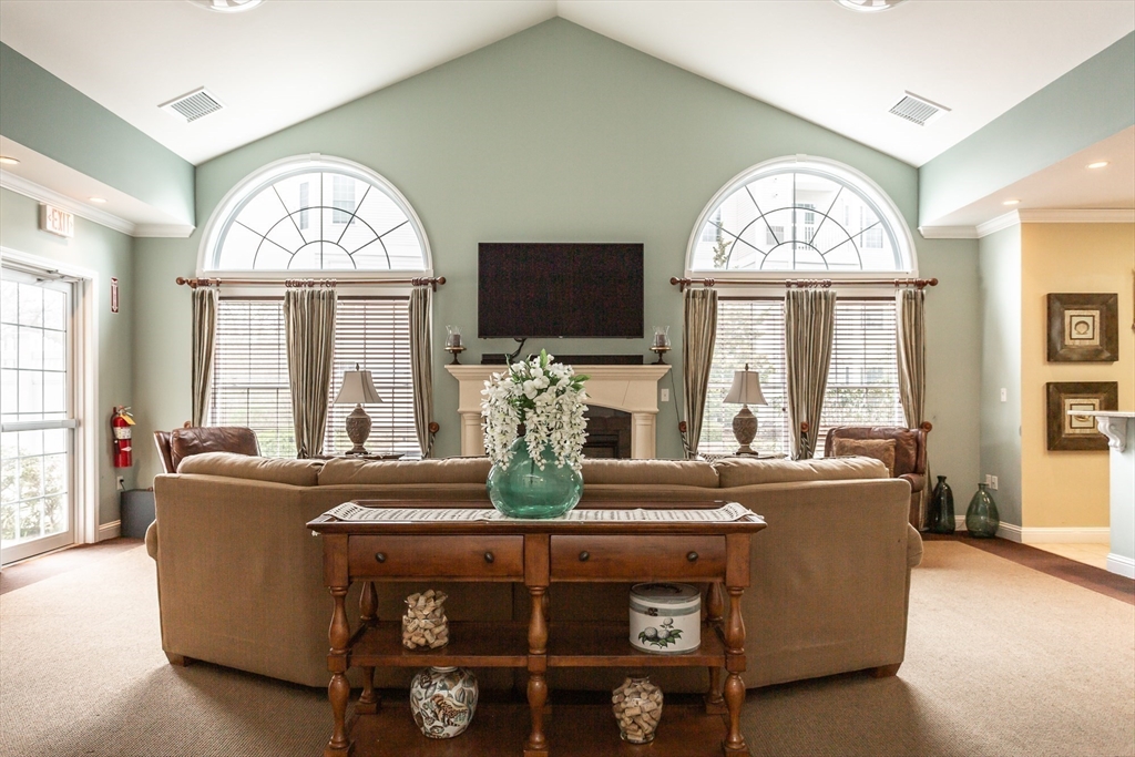 1481 Phillips Road, Unit 1305 New Bedford, MA 02745 - Photo 28 of 34 a living room with furniture and a flat screen tv