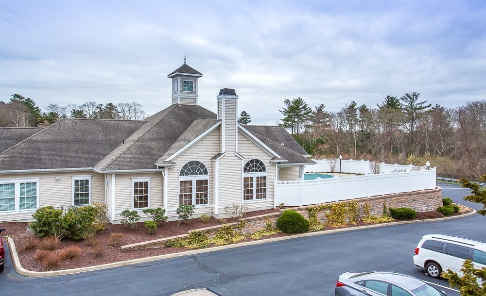 1481 Phillips Road, Unit 1305 New Bedford, MA 02745 - Photo 4 of 34 a front view of a house with garden