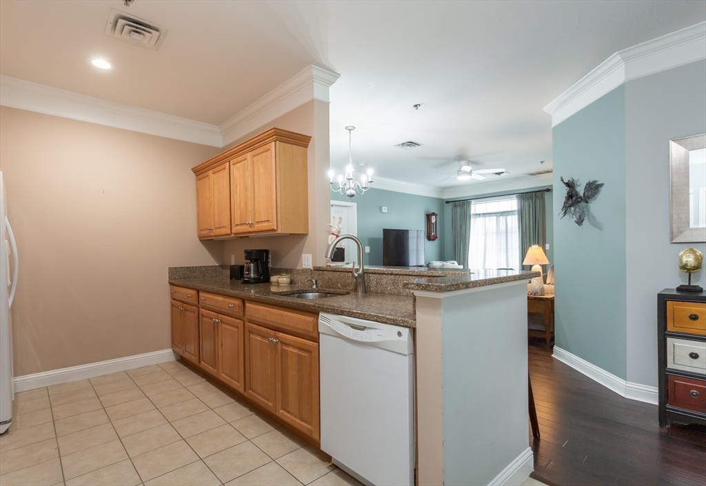 1481 Phillips Road, Unit 1305 New Bedford, MA 02745 - Photo 7 of 34 a kitchen with stainless steel appliances granite countertop a sink and cabinets