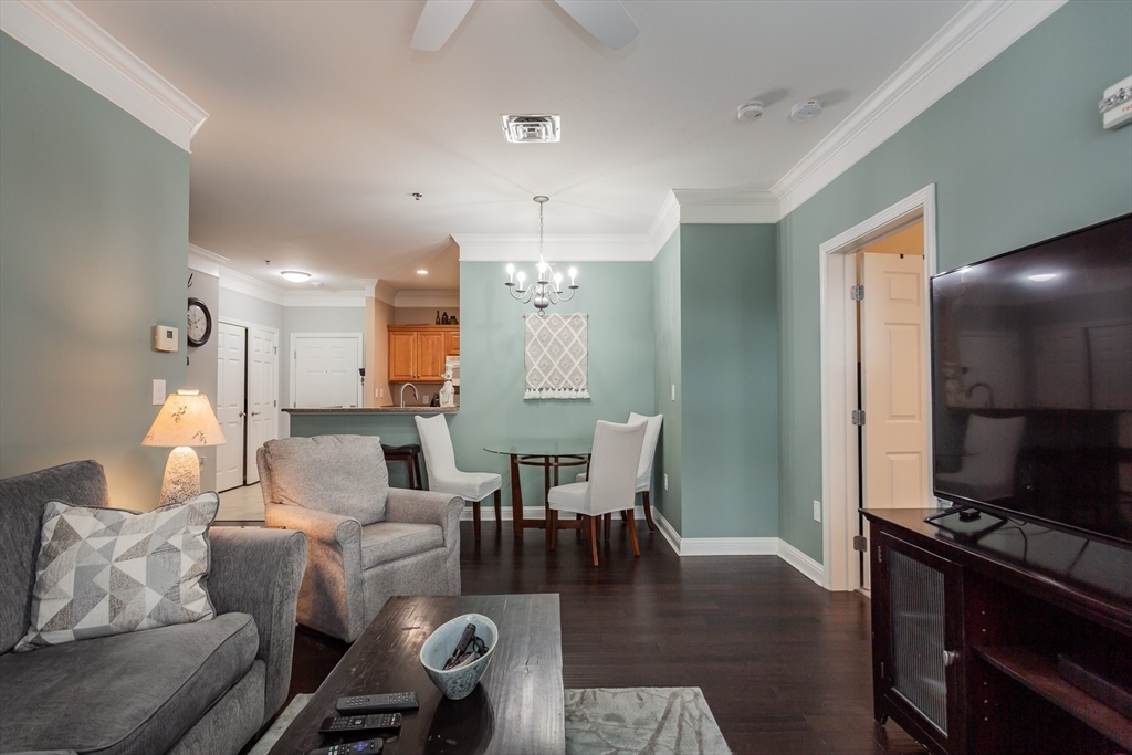 1481 Phillips Road, Unit 1305 New Bedford, MA 02745 - Photo 9 of 34 a living room with furniture and wooden floor