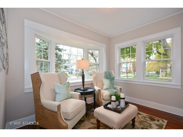 306 Spring Avenue Naperville, IL 60540 - Photo 2 of 25 a living room with furniture and a large window