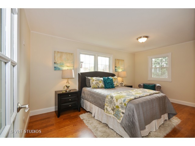 306 Spring Avenue Naperville, IL 60540 - Photo 13 of 25 a bedroom with a bed and a window
