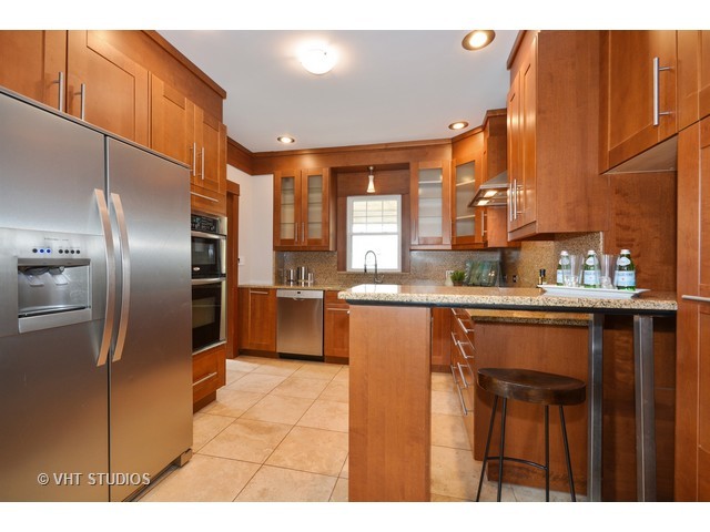 306 Spring Avenue Naperville, IL 60540 - Photo 3 of 25 a kitchen with stainless steel appliances granite countertop a refrigerator a sink a stove and oven