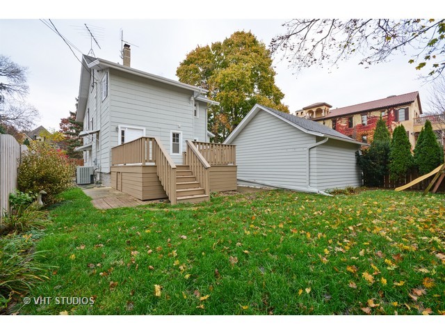 306 Spring Avenue Naperville, IL 60540 - Photo 25 of 25 a front view of a house with a garden