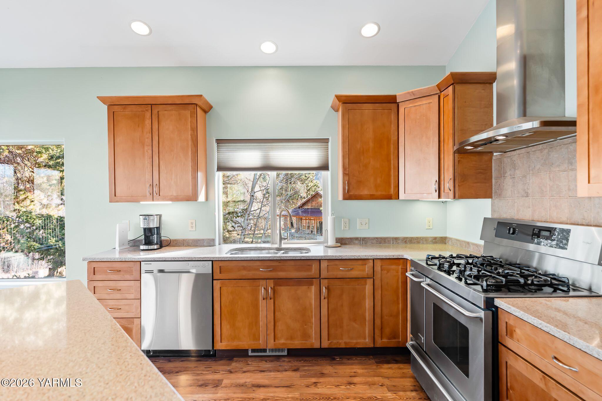 1575 Nile Road Naches, WA 98937 - Photo 16 of 51 a kitchen with stainless steel appliances a sink stove and cabinets