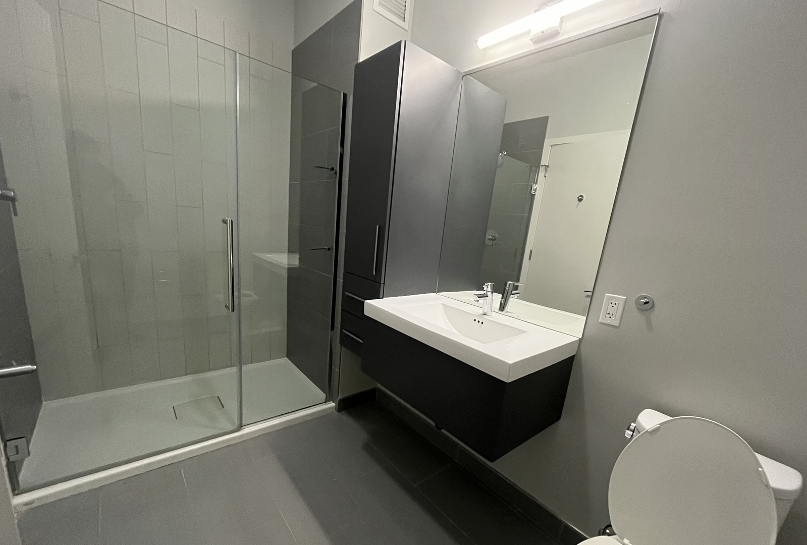 Undisclosed Address Chicago, IL 60647 - Photo 5 of 9 a bathroom with a sink a toilet and shower