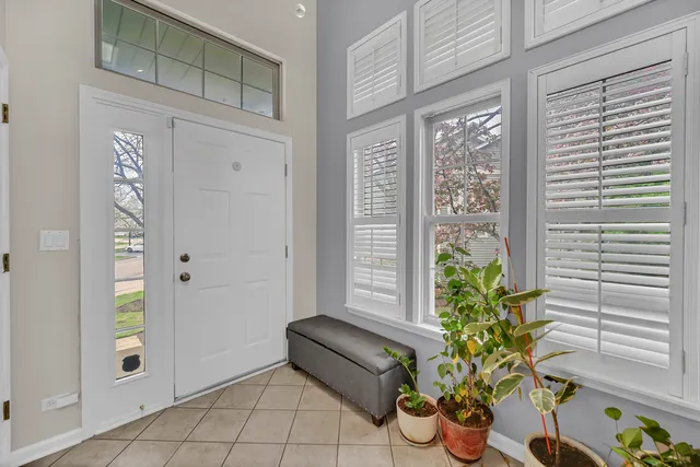 a view of an entryway with flower pots