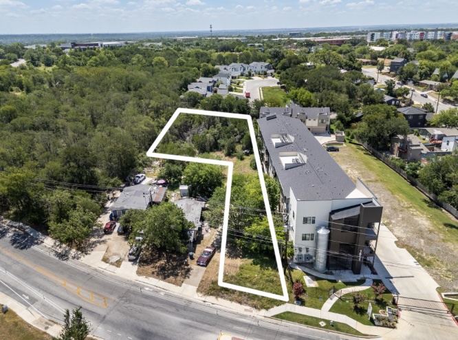 1813 Webberville Road Austin, TX 78721 - Photo 4 of 20 Aerial view captures a desirable lot, primed for development, alongside modern townhomes and a tree-lined street.