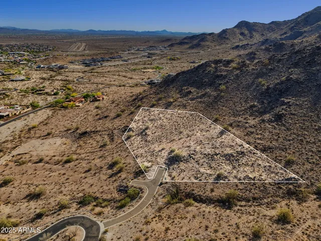 a view of a large body of water with a mountain in the background