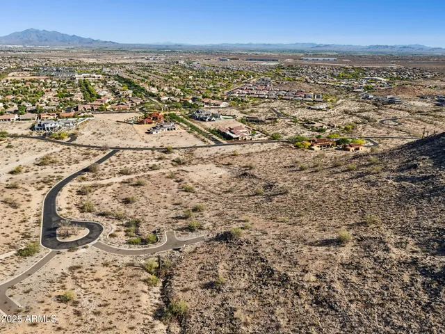 an aerial view of residential building and parking space