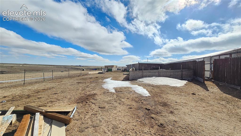 3835 Sengbeil Road Yoder, CO 80864 - Photo 6 of 48 a view of a dry yard with wooden fence